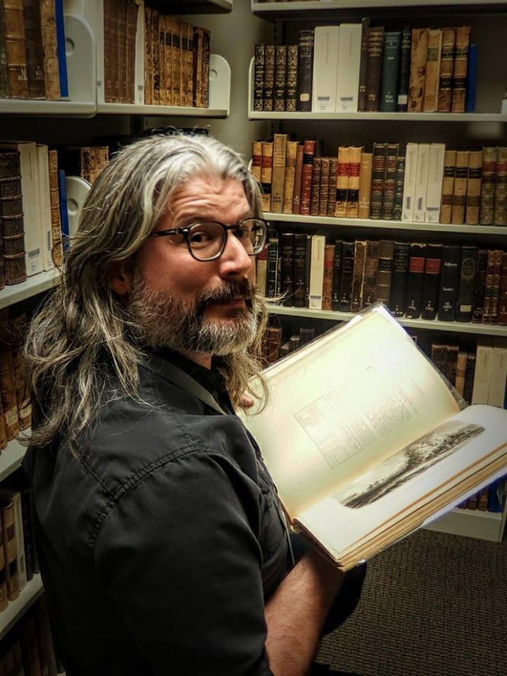 Man with archive book