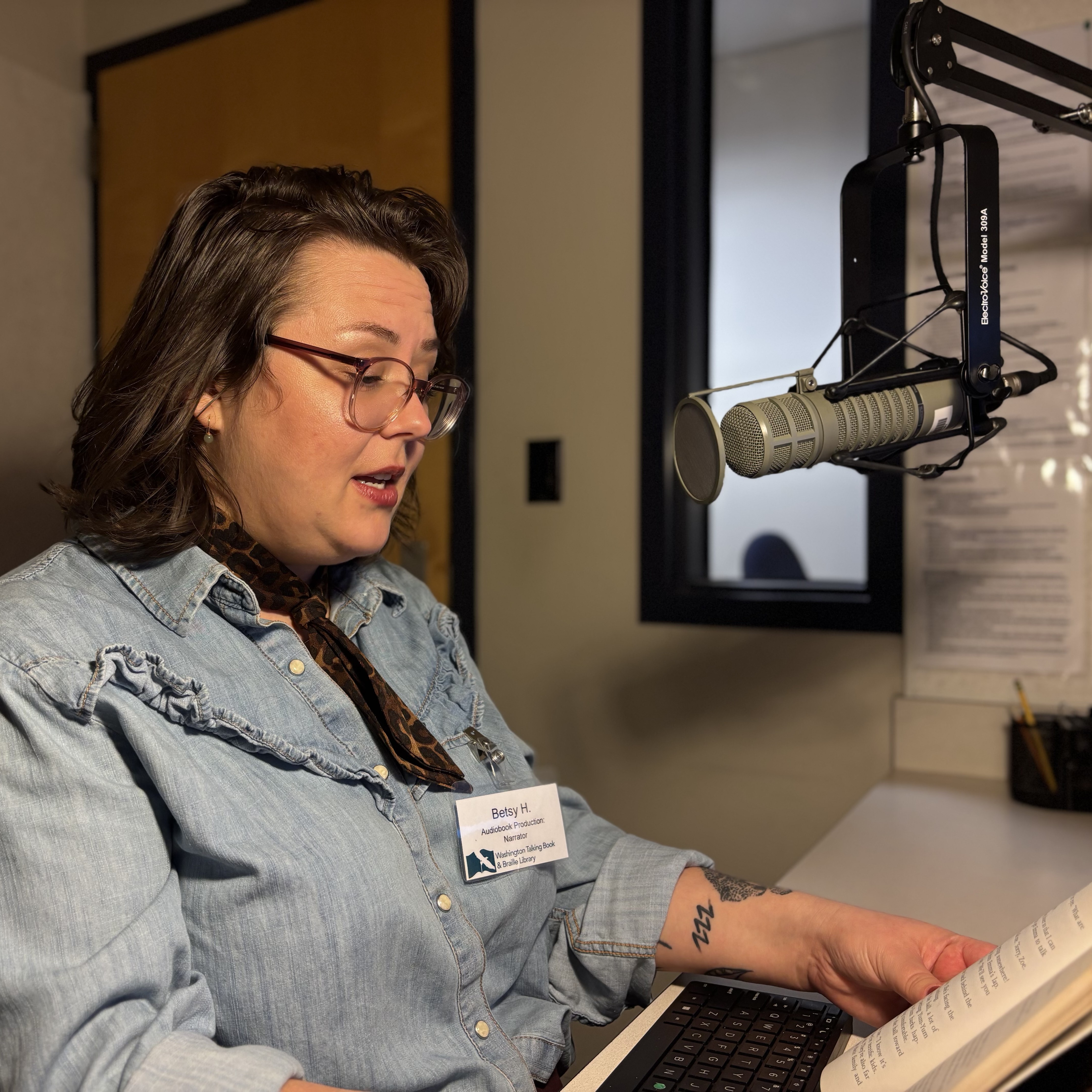 A volunteer records an audiobook.