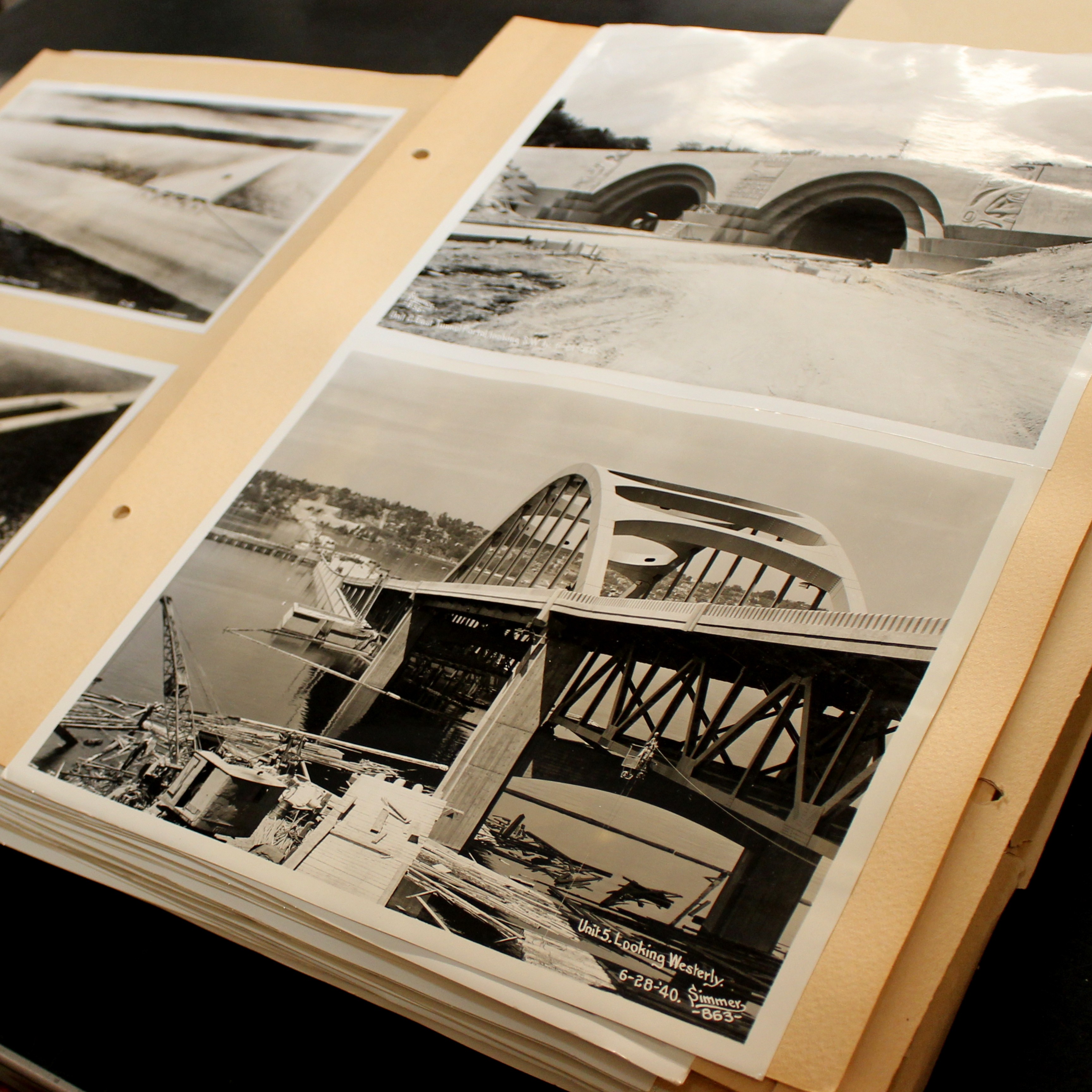 Images of bridges laid out on scrapbook.